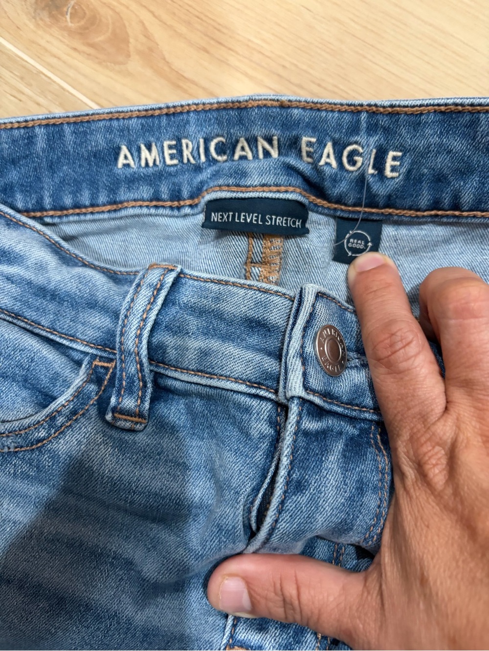 American Eagle Light Blue Denim Jeans with Tan Leather Patch